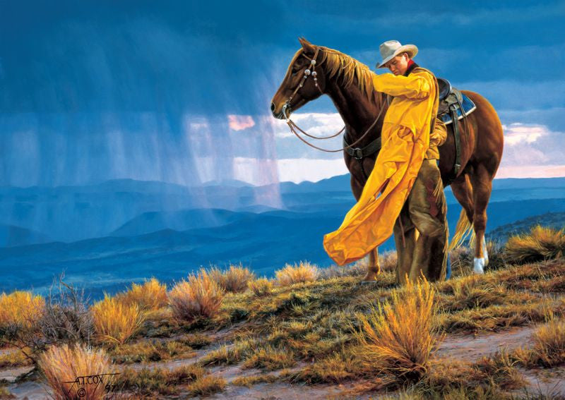 A Storm Across The Valley painting of Cowboy in yellow slicker with sorrel horse over looking mountains and oncoming storm